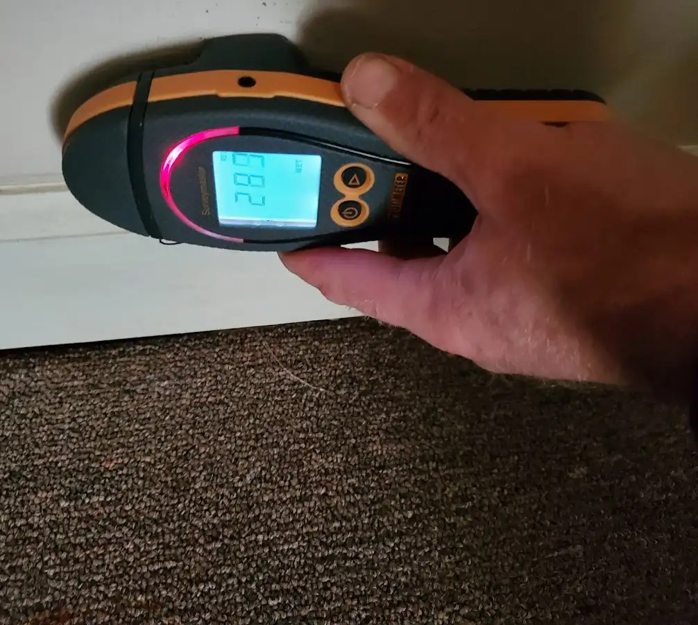 Moisture detection at baseboard during Burst Pipe Cleanup in McGregor